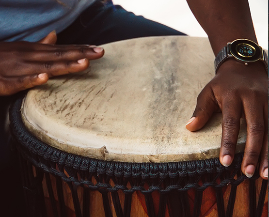 Hands playing a Caribbean drum
