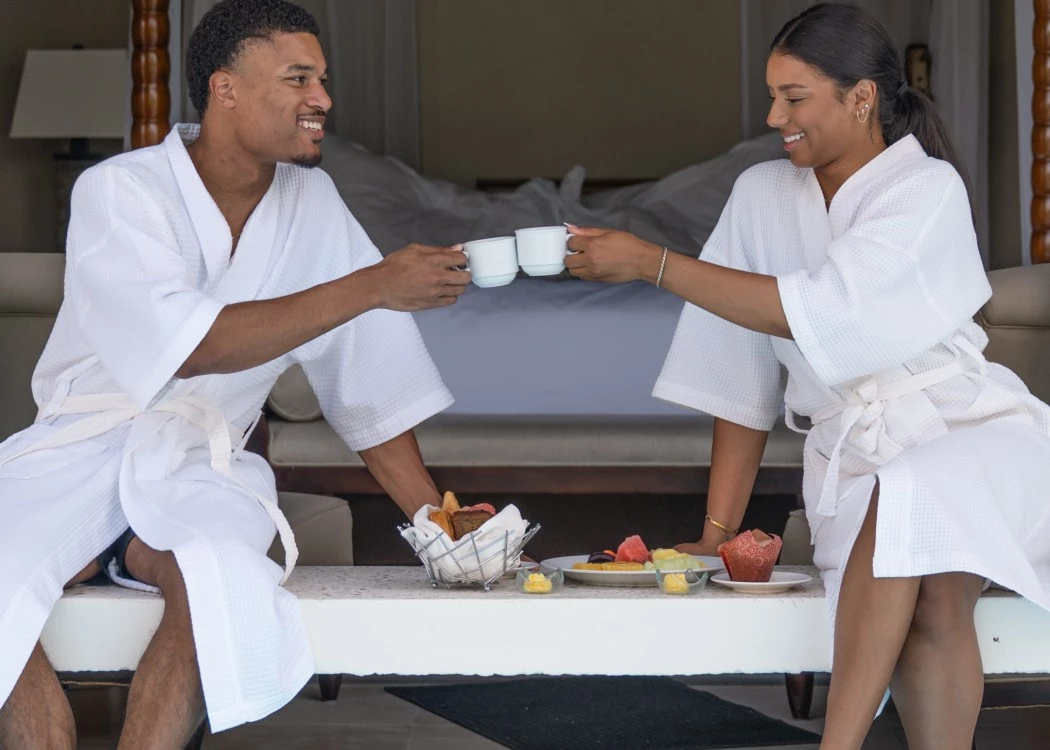 Couple enjoying breakfast in bed