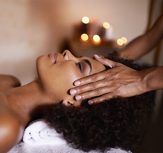 A woman receiving a facial